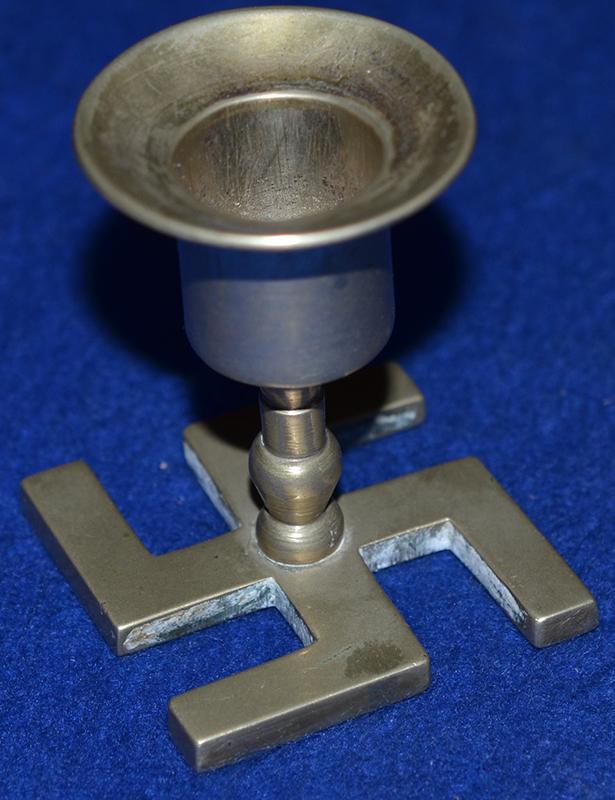 SWASTIKA CANDLE STICK.