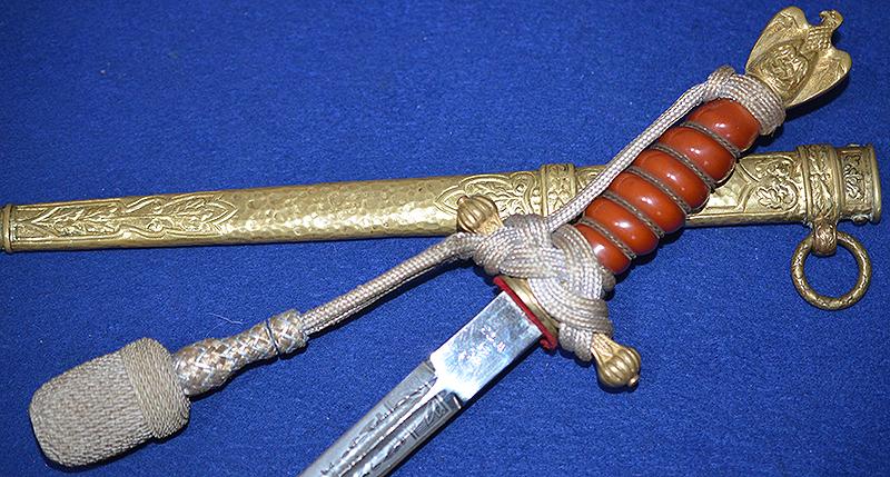 THIRD REICH NAVAL OFFICERS DAGGER BY WKC WITH VERY DARK ORANGE GRIP AND EXTREMLY RARE DELUX SCABBARR