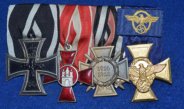 THIRD REICH SET OF FOUR PARADE MOUTED MEDALS FOR A POLICE OFFICER.