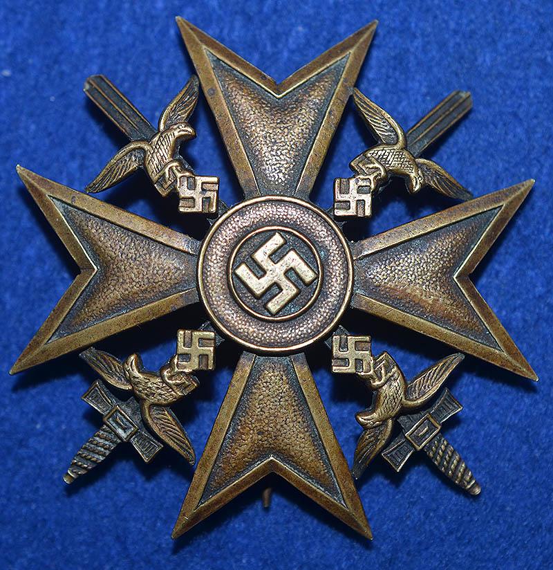 SPANISH CROSS IN BRONZE WITH SWORDS.
