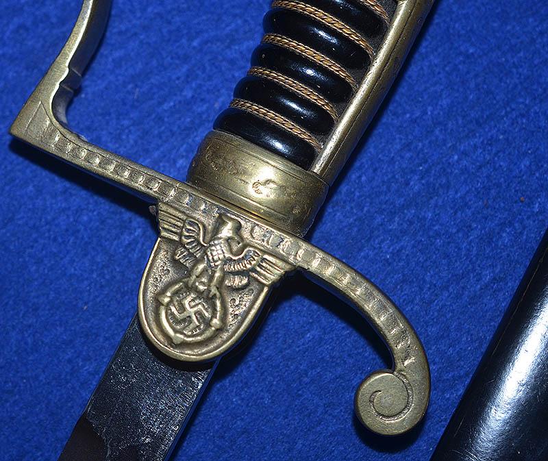 THIRD REICH ARMY OFFICERS SWORD BY ANTON WINGEN WITH RARE EARLY STYLE SHORT WING EAGLE AND SWASTIKA.