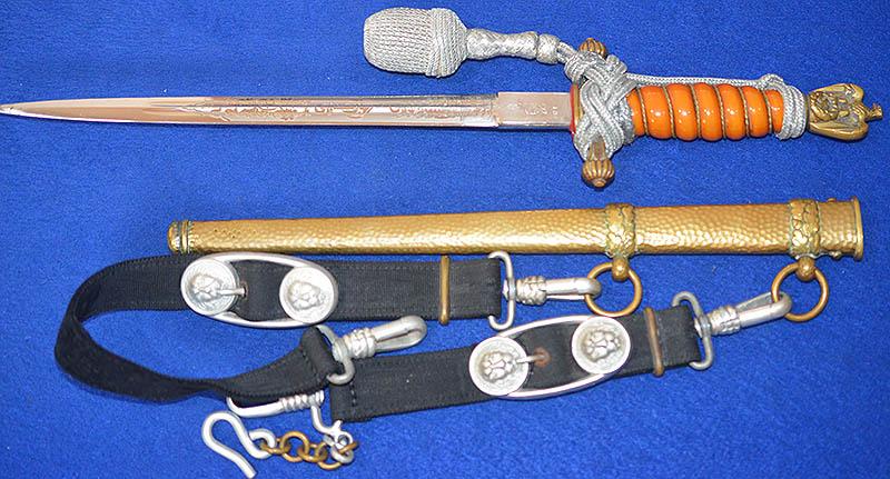 THIRD RICH NAVAL OFFICERS DAGGER BY WKC WITH ORANGE GRIP, HAMMERED SCABBARD AND STRAPS AND KNOT.