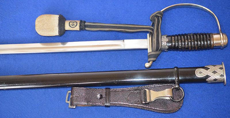 SS NCO SWORD BY KREBS COMPLETE WITH VERY RARE SS NCO KNOT AND BLACK LEATHER HANGER.