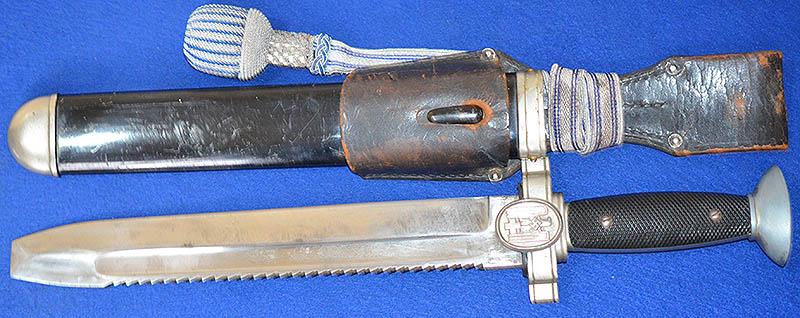 RED CROSS MANS DAGGER COMPLETE WITH FROG AND VERY RARE SILVER AND BLUE DRESS KNOT.