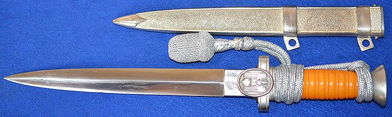 RED CROSS LEADERS DAGGER COMPLETE WITH SILVER KNOT.
