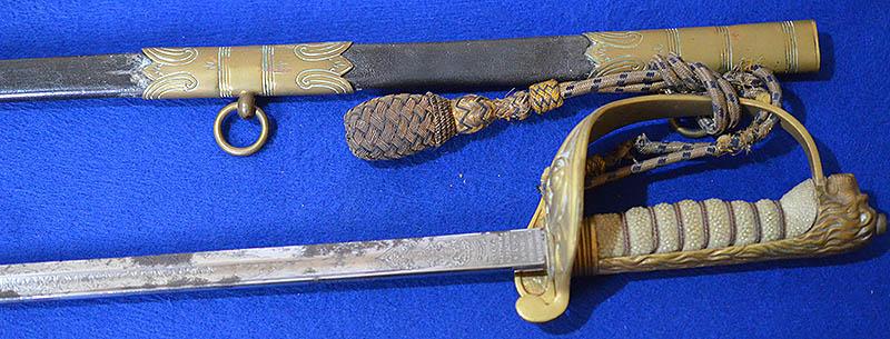 BRITISH WW1 NAVAL OFFICERS SWORD COMPLETE WITH KNOT & OWNERS  LEATHER SWORD BAG.