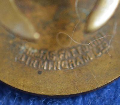 BRITISH SWASTIKA BADGE.