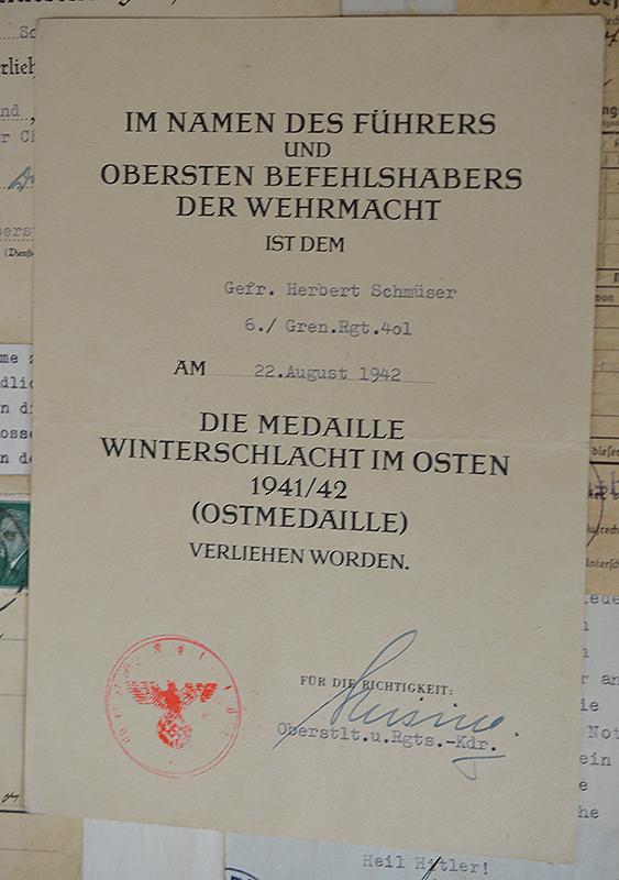 SET OF 10 ARMY AND NSDAP DOCUMENTS TO INFANTRY GEFREITER HERBERT SCHMUSER,KILLED IN ACTION IN RUSSIA 1942.