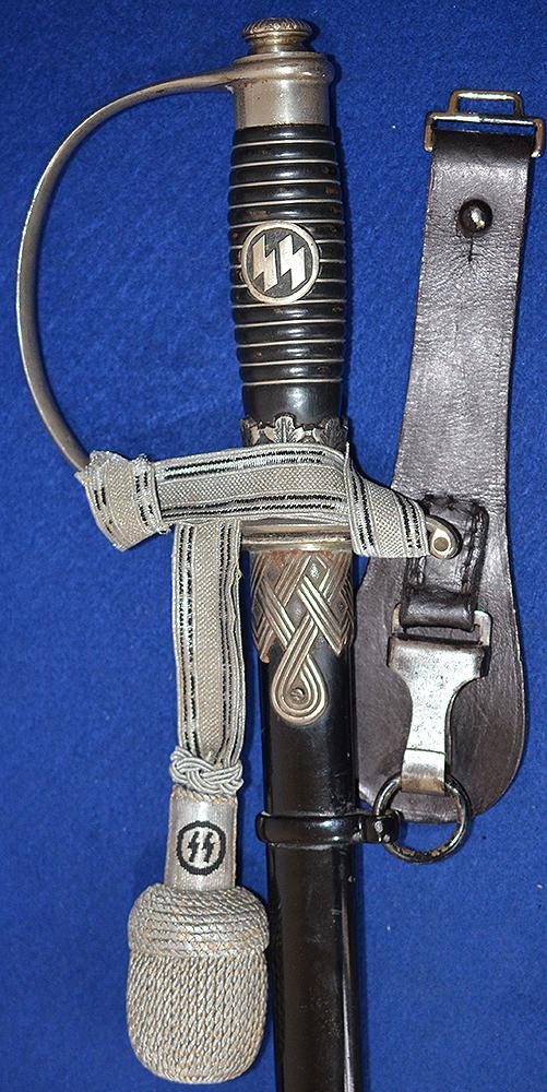 SS OFFICERS SWORD BY KREBS COMPLETE WITH SS KNOT AND BLACK LEATHER HANGER.