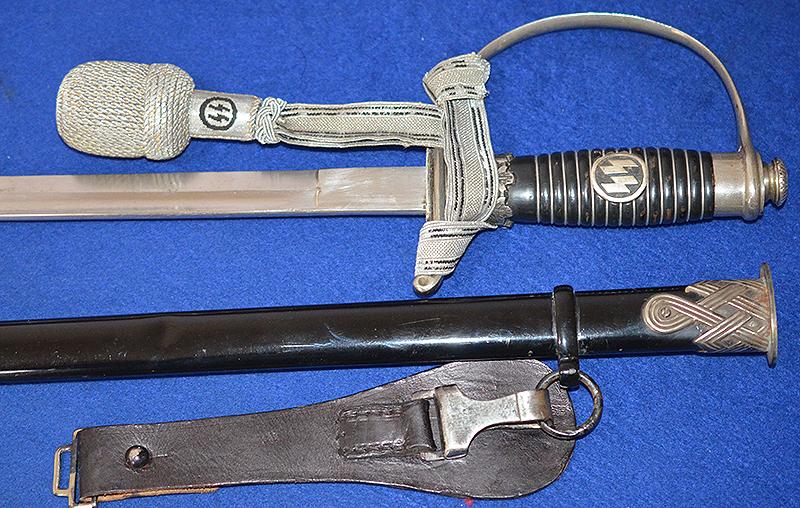 SS OFFICERS SWORD BY KREBS COMPLETE WITH SS KNOT AND BLACK LEATHER HANGER.