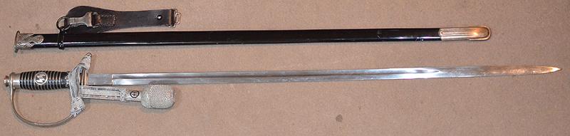 SS OFFICERS SWORD BY KREBS COMPLETE WITH SS KNOT AND BLACK LEATHER HANGER.