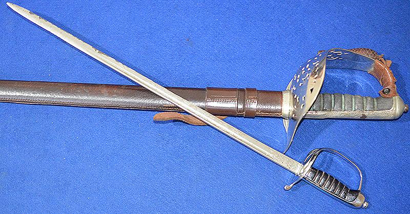 BRITISH 1930'S MINIATURE ARMY OFFICERS SWORD BY WILKINSON OF SUPERB QUALITY.