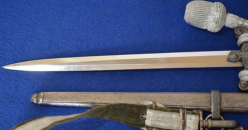 THIRD REICH ARMY OFFICERS DAGGER BY HOLLER COMPLETE WITH STRAPS AND KNOT.