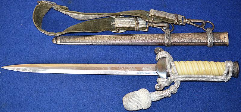 THIRD REICH ARMY OFFICERS DAGGER BY HOLLER COMPLETE WITH STRAPS AND KNOT.
