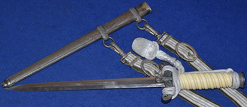 THIRD REICH ARMY OFFICERS DAGGER BY HOLLER COMPLETE WITH STRAPS AND KNOT.
