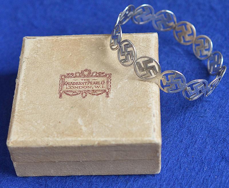 BRITISH 1920'S SILVER SWASTIKA DECORATED BANGLE COMPLETE WITH BOX.