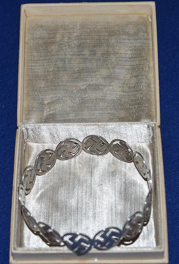 BRITISH 1920'S SILVER SWASTIKA DECORATED BANGLE COMPLETE WITH BOX.