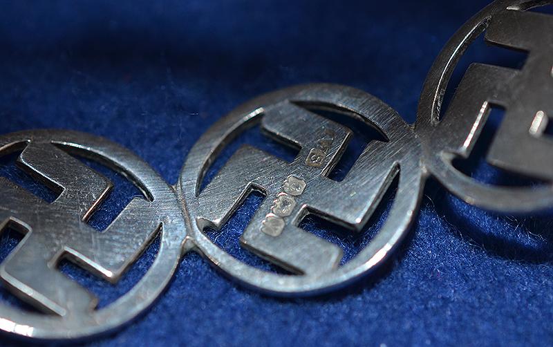 BRITISH 1920'S SILVER SWASTIKA DECORATED BANGLE COMPLETE WITH BOX.