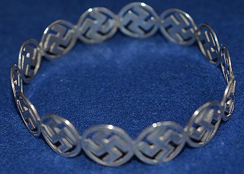 BRITISH 1920'S SILVER SWASTIKA DECORATED BANGLE COMPLETE WITH BOX.
