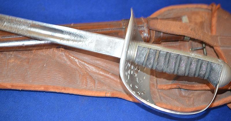 BRITISH WW1 ARMY OFFICERS SWORD WITH ORIGINAL LEATHER STORAGE BAG.
