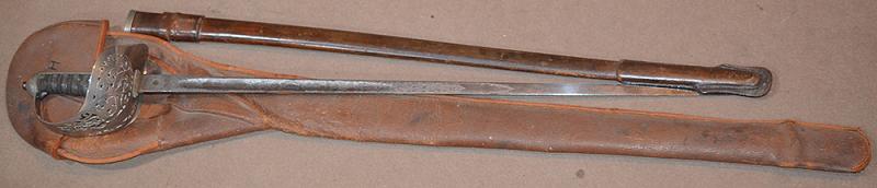 BRITISH WW1 ARMY OFFICERS SWORD WITH ORIGINAL LEATHER STORAGE BAG.