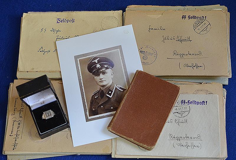 WAFFEN SS SILVER FINGER RING, MILITARY DIARY AND A QUANTITY OF WAFFEN SS MARKED LETTERS BELONGING TO SS UNTERSHARFUHRER JULIUS SCHMIDT.