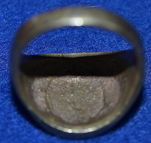 SWASTIKA DECORATED FINGER RING.