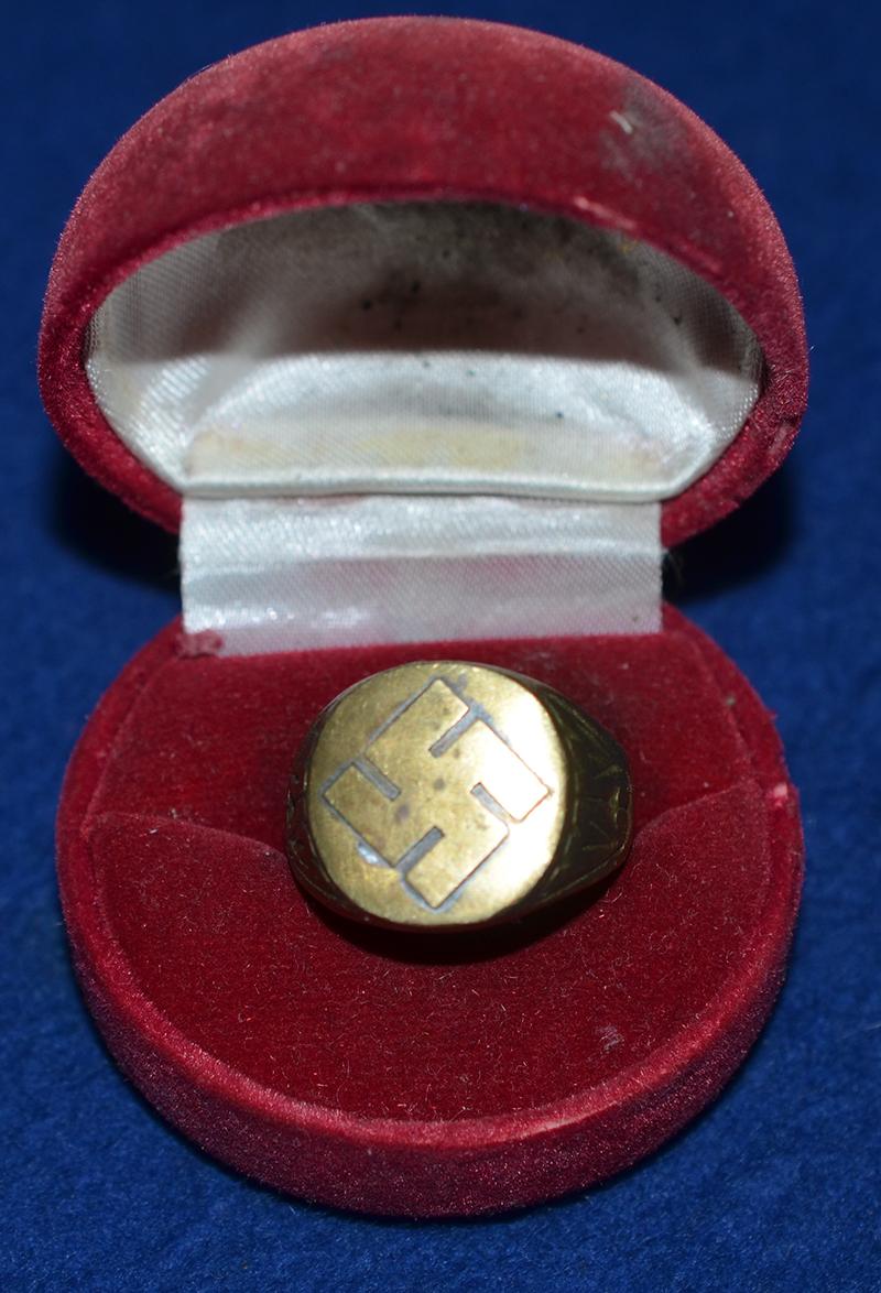 SWASTIKA DECORATED FINGER RING.