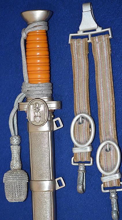 RED CROSS LEADERS DAGGER COMPLETE WITH STRAPS AND KNOT, MINT CONDITION.