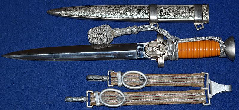 RED CROSS LEADERS DAGGER COMPLETE WITH STRAPS AND KNOT, MINT CONDITION.