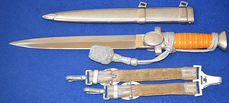 RED CROSS LEADERS DAGGER COMPLETE WITH STRAPS AND KNOT, MINT CONDITION.