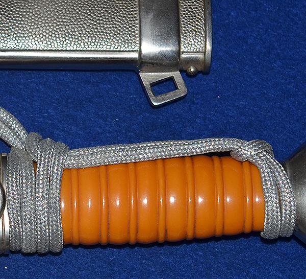 RED CROSS LEADERS DAGGER COMPLETE WITH STRAPS AND KNOT, MINT CONDITION.