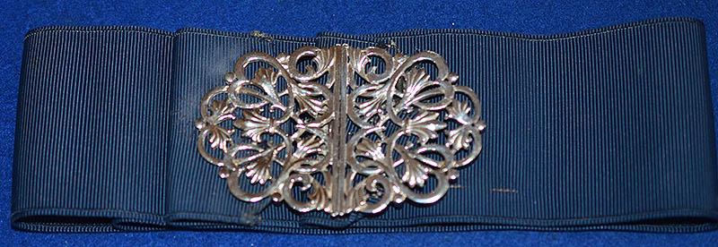 BRITISH NURSES SILVER HALLMARKED BUCKLE COMPLETE WITH ORIGINAL CLOTH SERVICE BELT.