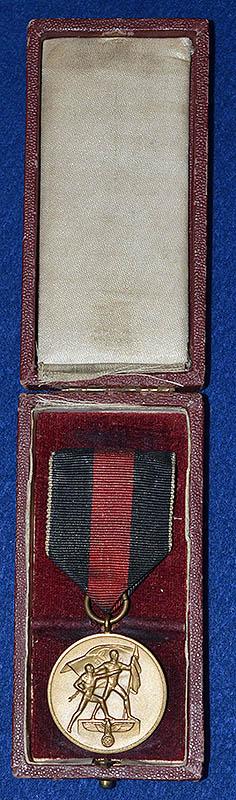 CASED 1ST OF OCTOBER MEDAL.