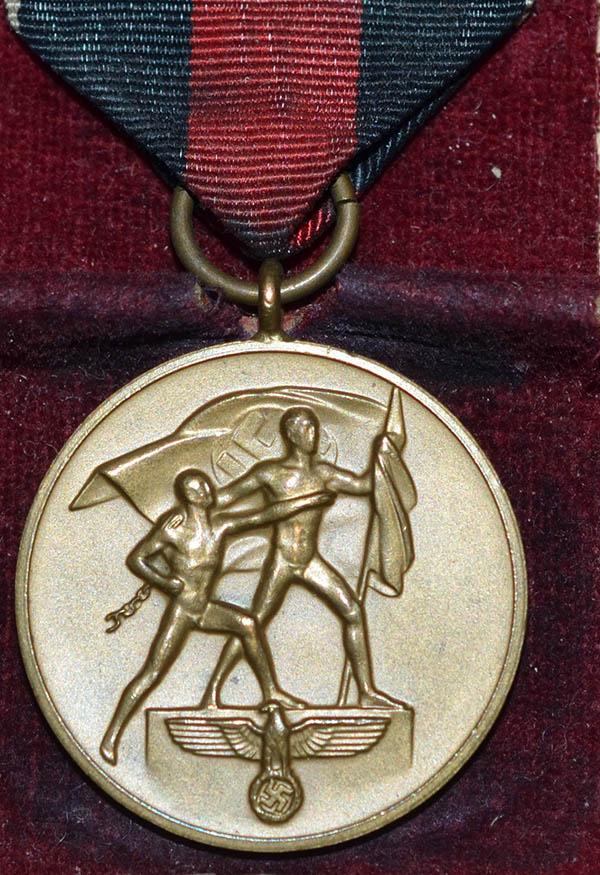 CASED 1ST OF OCTOBER MEDAL.