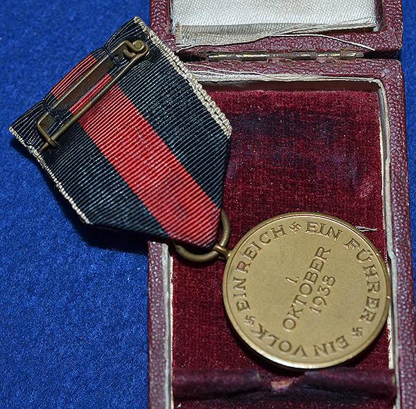 CASED 1ST OF OCTOBER MEDAL.