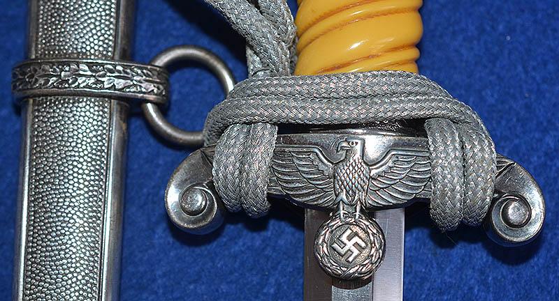 GERMAN ARMY OFFICERS DAGGER 1935 MODEL BY HOLLER COMPLETE WITH SILVER KNOT.