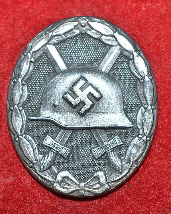 THIRD REICH CASED SILVER WOUND BADGE BY STEINHAUER & LUCK.