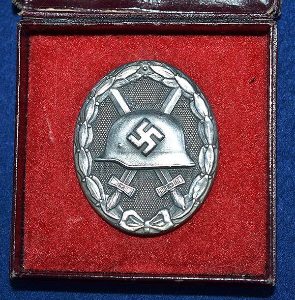 THIRD REICH CASED SILVER WOUND BADGE BY STEINHAUER & LUCK.